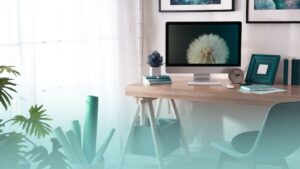 organized home office with natural light, plants and artwork to support employee wellness and productivity