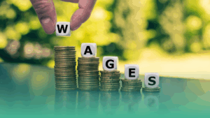 Stacked coins spelling “wages,” representing minimum wage increases across Canadian provinces in 2025.