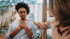 Employee receiving workplace accommodation support during a discussion about mental health accommodations and employer duties under Ontario human rights law.